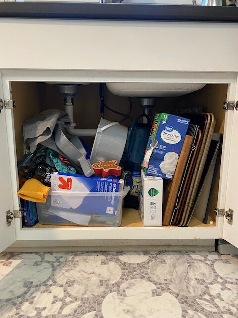 A cluttered under the sink mess deserves a 2-tier organizer for instant calm!
